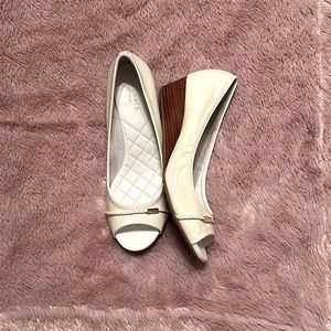 Like new Cole Haan white patent leather peep toe wedges. Size 8. Only worn once.